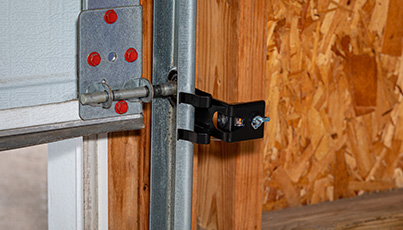 Close-up of garage door hardware and spring mechanism